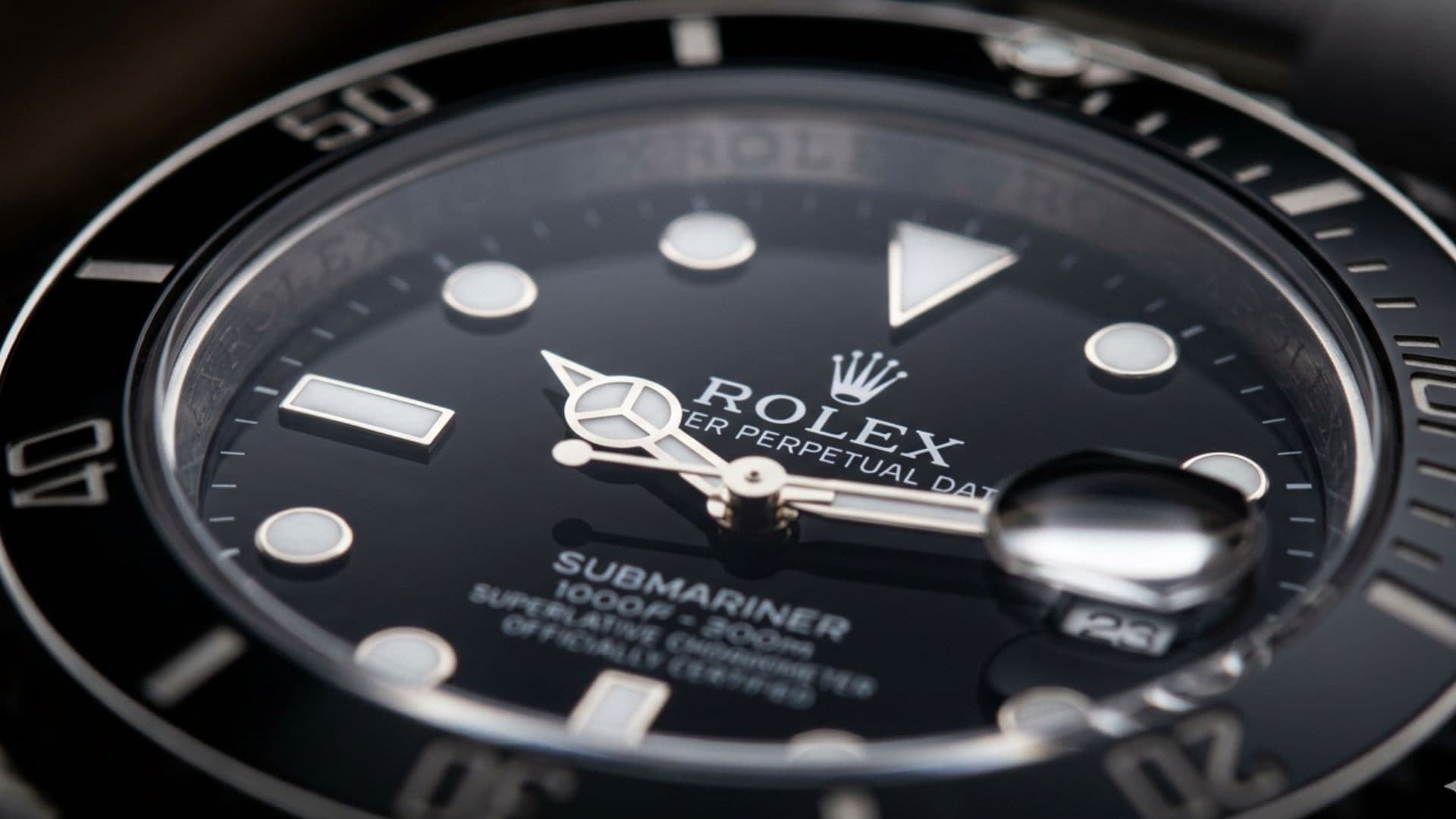 Macro shot of a Rolex Submariner dial showing precision details